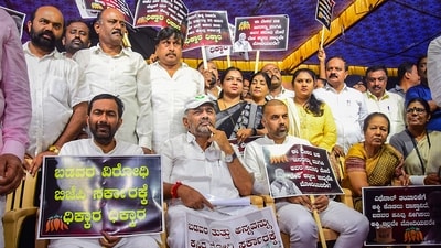 Karnataka DCM DK Shivakumar with party leaders during a protest against the BJP-led central government for allegedly denying rice for the state government's Anna Bhagya scheme in Bengaluru on Tuesday. (PTI) Karnataka DCM DK Shivakumar with party leaders during a protest against the BJP-led central government for allegedly denying rice for the state government's Anna Bhagya scheme in Bengaluru on Tuesday. (PTI)