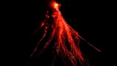 Lava flows down the slopes of Mayon volcano as seen from Legazpi, Albay province, northeastern Philippines. Thousands of poor Filipinos risk their lives by living and working in villages inside a permanent danger zone around Mayon volcano. (AP Photo/Aaron Favila, File) Lava flows down the slopes of Mayon volcano as seen from Legazpi, Albay province, northeastern Philippines. Thousands of poor Filipinos risk their lives by living and working in villages inside a permanent danger zone around Mayon volcano. (AP Photo/Aaron Favila, File)