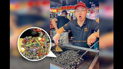 Stir-fried pebbles, made with small river rocks with chilli, garlic, purple perilla and rosemary Stir-fried pebbles, made with small river rocks with chilli, garlic, purple perilla and rosemary