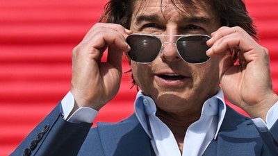 Tom Cruise puts on his sunglasses as he poses ahead of the premiere of Mission Impossible Dead Reckoning Part One in Rome. (AFP) Tom Cruise puts on his sunglasses as he poses ahead of the premiere of Mission Impossible Dead Reckoning Part One in Rome. (AFP)