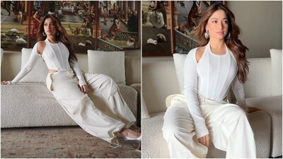 Tamannaah's outfit is from the shelves of the clothing label Dion Lee. It features a sleeveless corset blouse featuring a U neckline, corseted boning on the front, an asymmetric cropped hem, a ribbed design, and a bodycon silhouette accentuating her frame. (Instagram) Tamannaah's outfit is from the shelves of the clothing label Dion Lee. It features a sleeveless corset blouse featuring a U neckline, corseted boning on the front, an asymmetric cropped hem, a ribbed design, and a bodycon silhouette accentuating her frame. (Instagram)