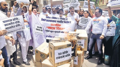 Thane, India - June, 20, 2023: MLA jitendra ahwad with Thane NCP party workers on Tuesday staged a protest outside the NCP office in Thane by burning boxes against Chief Minister Eknath Shinde calling it "Gaddar divas" ,in Thane, in Mumbai, India, on,Tuesday, June, 20, 2023. ( Praful Gangurde / HT Photo ) Thane, India - June, 20, 2023: MLA jitendra ahwad with Thane NCP party workers on Tuesday staged a protest outside the NCP office in Thane by burning boxes against Chief Minister Eknath Shinde calling it "Gaddar divas" ,in Thane, in Mumbai, India, on,Tuesday, June, 20, 2023. ( Praful Gangurde / HT Photo )