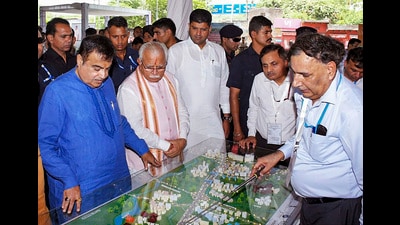 Union minister Nitin Gadkari with Haryana chief minister Manohar Lal Khattar and deputy chief minister Dushyant Chautala inspects the model of 11 flyovers on the eight-lane National Highway from Delhi to Panipat, in Sonipat on Tuesday. (PTI) Union minister Nitin Gadkari with Haryana chief minister Manohar Lal Khattar and deputy chief minister Dushyant Chautala inspects the model of 11 flyovers on the eight-lane National Highway from Delhi to Panipat, in Sonipat on Tuesday. (PTI)
