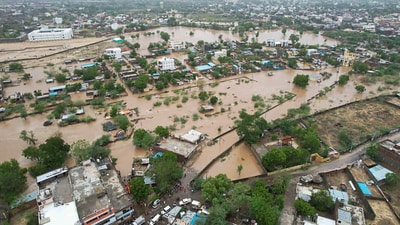 An aerial view of a flooded area after heavy rainfall caused by cyclone Biparjoy, in Sanchore, Rajasthan. (PTI) An aerial view of a flooded area after heavy rainfall caused by cyclone Biparjoy, in Sanchore, Rajasthan. (PTI)