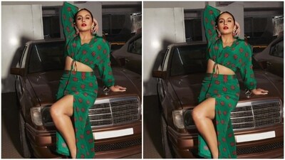 Huma decked up in a green cropped top featuring collars and quarter sleeves, and block prints in shades of red. Showing off her midriff, Huma further teamed it with a matching long bodycon skirt with a thigh high slit. (Instagram/@iamhumaq) Huma decked up in a green cropped top featuring collars and quarter sleeves, and block prints in shades of red. Showing off her midriff, Huma further teamed it with a matching long bodycon skirt with a thigh high slit. (Instagram/@iamhumaq)