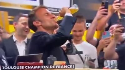 Screengrab from the viral video showing French President Emmanuel Macron chugging a beer bottle. Screengrab from the viral video showing French President Emmanuel Macron chugging a beer bottle.