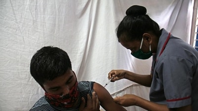 A Covid jab is administered to a person by a health official. (HT File Photo)