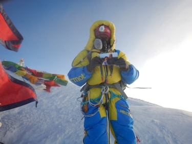 Jayanthi on the summit of Everest with a photograph of her parents 21 May 2016 (Photo Credit Sherpa Ang Karma)