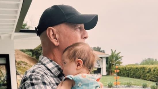 The photos show Bruce Willis lovingly holding eight-week-old Louetta (rumerwillis/Instagram)