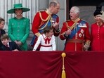Britain's King Charles, Queen Camilla, Prince William, Catherine, Princess of Wales, Prince George, Princess Charlotte and Prince Louis appear on the balcony of Buckingham Palace.