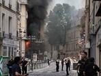 Smoke billows from a building party collapsed at Place Alphonse-Laveran in the 5th arrondissement of Paris.