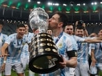 FILE - Argentina's Lionel Messi kisses the trophy after beating Brazil 1-0 in the Copa America final