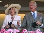 Britain's Queen Camilla (L) and Britain's King Charles III react. Britain's Queen Camilla (L) and Britain's King Charles III react.