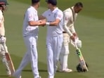 James Anderson (2nd from right) diffused the tension between Ollie Robinson and Usman Khawaja James Anderson (2nd from right) diffused the tension between Ollie Robinson and Usman Khawaja