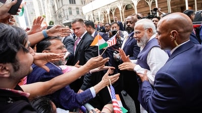 PM Modi in US: Narendra Modi greets supporters of the Indian community on the way to the Lotte New York Palace Hotel, his stay in New York. (AP) PM Modi in US: Narendra Modi greets supporters of the Indian community on the way to the Lotte New York Palace Hotel, his stay in New York. (AP)