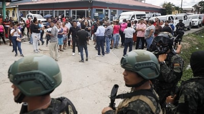 Police guard the entrance to the women's prison in Tamara, on the outskirts of Tegucigalpa, Honduras, Tuesday, June 20, 2023. A riot at the women's prison northwest of the Honduran capital has left at least 41 inmates dead, most of them burned to death, a Honduran police official said. (AP) Police guard the entrance to the women's prison in Tamara, on the outskirts of Tegucigalpa, Honduras, Tuesday, June 20, 2023. A riot at the women's prison northwest of the Honduran capital has left at least 41 inmates dead, most of them burned to death, a Honduran police official said. (AP)