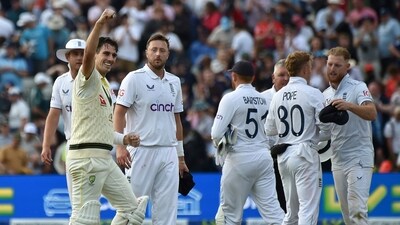 Australia captain Pat Cummins, left, celebrates after beating England during on day five of the first Ashes Test (AP) Australia captain Pat Cummins, left, celebrates after beating England during on day five of the first Ashes Test (AP)
