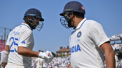 India's Cheteshwar Pujara (L) greets India's captain Rohit Sharma (AFP) India's Cheteshwar Pujara (L) greets India's captain Rohit Sharma (AFP)