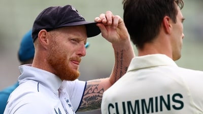 England's Ben Stokes with Australia's Pat Cummins after Australia win the first Test (Action Images via Reuters)
