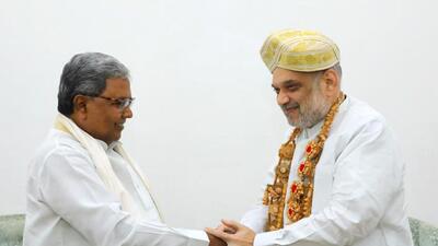 Karnataka chief minister Siddaramaiah with union home minister Amit Shah in New Delhi. (PTI) Karnataka chief minister Siddaramaiah with union home minister Amit Shah in New Delhi. (PTI)