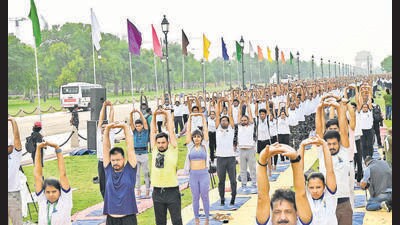 People perform yoga at Kartavya Path in Delhi on Wednesday. (Arvind Yadav/ HT Photo)