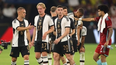 Germany's Robin Gosens and Julian Brandt look dejected as Joshua Kimmich shakes hands with Colombia's Luis Diaz (REUTERS)