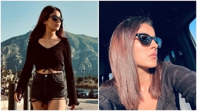 Shehnaaz Gill struts the Sicily streets in a black crop top and denim shorts during her holiday. (Instagram) Shehnaaz Gill struts the Sicily streets in a black crop top and denim shorts during her holiday. (Instagram)