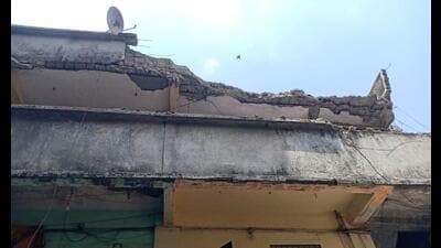 The terrace slab of two storey Sai Sapna Building, a 35 to 40 years old building in Kalwa’s Kharegaon in Thane, on the second floor collapsed on Wednesday. No casualties were reported. (Praful Gangurde/HT PHOTO) The terrace slab of two storey Sai Sapna Building, a 35 to 40 years old building in Kalwa’s Kharegaon in Thane, on the second floor collapsed on Wednesday. No casualties were reported. (Praful Gangurde/HT PHOTO)