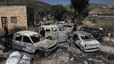 A picture shows burnt cars, reportedly set ablaze by Israeli settlers, in the area of in al-Lubban al-Sharqiya in the occupied West Bank on June 21, 2023. (AFP) A picture shows burnt cars, reportedly set ablaze by Israeli settlers, in the area of in al-Lubban al-Sharqiya in the occupied West Bank on June 21, 2023. (AFP)