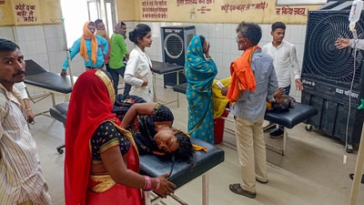 View of a ward where a jumbo cooler has been installed for the heat stroke patients admitted at a hospital during extreme weather conditions, in Ballia, Monday. (PTI) View of a ward where a jumbo cooler has been installed for the heat stroke patients admitted at a hospital during extreme weather conditions, in Ballia, Monday. (PTI)