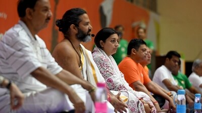 Minister of women and child development and Lok Sabha MP Smriti Irani along with MP Dr Mahesh Sharma performs yoga on International Yoga Day at Noida indoor Stadium, Sector 21-A, in Noida. (Hindustan Times/ Sunil Ghosh) Minister of women and child development and Lok Sabha MP Smriti Irani along with MP Dr Mahesh Sharma performs yoga on International Yoga Day at Noida indoor Stadium, Sector 21-A, in Noida. (Hindustan Times/ Sunil Ghosh)