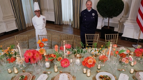 White House Executive Chef Cristeta Comerford and Guest Chef Nina Curtis pose as they present dishes from the menu during a media preview in advance of Thursday's State Dinner as part of Indian Prime Minister Narendra Modi's official visit to the United States, in the State Dining Room of the White House in Washington.(REUTERS)
