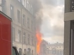 Flames and smoke erupt from a building following an explosion (Representative image)