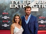 Spanish actress Elsa Pataky (L) and her husband Australian actor Chris Hemsworth pose for photographers on the red carpet as they arrive for the premiere of the Netflix movie 'Tyler Rake: Extraction 2' in Berlin on June 9, 2023. (Photo by John MACDOUGALL / AFP)