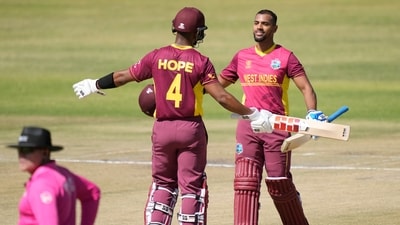 West Indies batsman Nicholas Pooran and Shai Hope celebrate after they both scored 100 runs during their ICC Men's Cricket World Cup Qualifier match against Nepal at Harare Sports Club in Harare, Zimbabwe, Thursday June, 22, 2023. AP/PTI(AP06_22_2023_000210B) (AP) West Indies batsman Nicholas Pooran and Shai Hope celebrate after they both scored 100 runs during their ICC Men's Cricket World Cup Qualifier match against Nepal at Harare Sports Club in Harare, Zimbabwe, Thursday June, 22, 2023. AP/PTI(AP06_22_2023_000210B) (AP)
