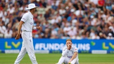 England's Ben Stokes reacts as Stuart Broad looks on ( Reuters)