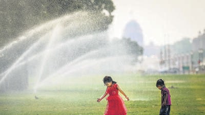 Children cool off at the Central Vista lawns, near India Gate, on a humid Thursday. (Sanchit Khanna/ HT Photo) Children cool off at the Central Vista lawns, near India Gate, on a humid Thursday. (Sanchit Khanna/ HT Photo)