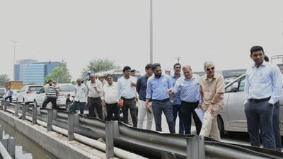 Gurugram MP Rao Inderjit Singh along with officials of the civic agencies inspect a waterlogged road on Thursday. (Parveen Kumar/ HT)