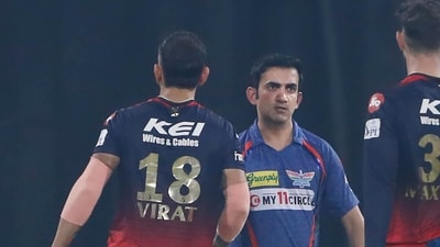 Lucknow Super Giants mentor Gautam Gambhir, center, congratulates Royal Challengers Bangalore's Virat Kohli ,left, after Kohli's team won the match (AP) Lucknow Super Giants mentor Gautam Gambhir, center, congratulates Royal Challengers Bangalore's Virat Kohli ,left, after Kohli's team won the match (AP)