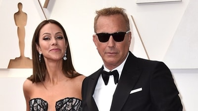 Christine Baumgartner and Kevin Costner arrive at the Oscars, March 27, 2022, at the Dolby Theatre in Los Angeles (Photo by Jordan Strauss/Invision/AP, File) Christine Baumgartner and Kevin Costner arrive at the Oscars, March 27, 2022, at the Dolby Theatre in Los Angeles (Photo by Jordan Strauss/Invision/AP, File)