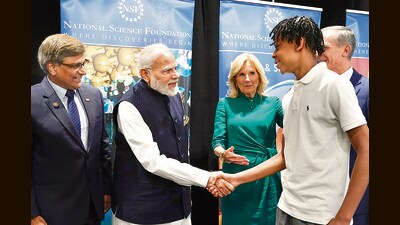 Prime Minister Narendra Modi and First Lady Jill Biden greet a youngster, Noah Isirimah, during their visit to the National Science Foundation in Alexandria on Wednesday. (AP)