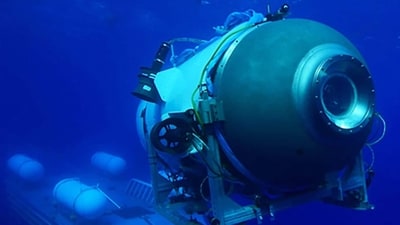 TOPSHOT - This undated image courtesy of OceanGate Expeditions, shows their Titan submersible launching from a platform. (AFP) TOPSHOT - This undated image courtesy of OceanGate Expeditions, shows their Titan submersible launching from a platform. (AFP)