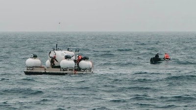 FILE - In this image released by Action Aviation, the submersible Titan is prepared for a dive into a remote area of the Atlantic Ocean on an expedition to the Titanic on Sunday, June 18, 2023. Rescuers are racing against time to find the missing submersible carrying five people, who were reported overdue Sunday night. (Action Aviation via AP, File) (AP) FILE - In this image released by Action Aviation, the submersible Titan is prepared for a dive into a remote area of the Atlantic Ocean on an expedition to the Titanic on Sunday, June 18, 2023. Rescuers are racing against time to find the missing submersible carrying five people, who were reported overdue Sunday night. (Action Aviation via AP, File) (AP)