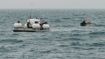 In this image released by Action Aviation, the submersible Titan is prepared for a dive into a remote area of the Atlantic Ocean on an expedition to the Titanic on Sunday, June 18, 2023. (AP) In this image released by Action Aviation, the submersible Titan is prepared for a dive into a remote area of the Atlantic Ocean on an expedition to the Titanic on Sunday, June 18, 2023. (AP)