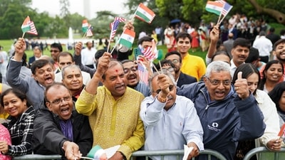 Attendees wave the flags of India and the United States as they gather on the South Lawn of the White House to watch an official State Arrival ceremony as US on Thursday. (Reuters)