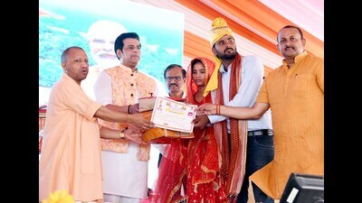 Uttar Pradesh chief minister Yogi Adityanath blessing a couple at a mass marriage event in Gorakhpur on June 22. (HT photo)