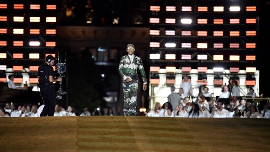 Pharrell Williams acknowledges the audience at the end of the Louis Vuitton Menswear Spring-Summer 2024 show. Appointed in February to fill the immense shoes left by the death of Virgil Abloh, Williams unveiled his design prowess to the fashion world with a show that exuded confidence.&nbsp;(AFP)