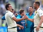 Australia's Pat Cummins shakes hands with Josh Hazlewood after wining the first Test 