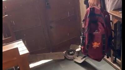 A grab from the video sourced by HT City, showing the fan that fell in a classroom of Hansraj College. A grab from the video sourced by HT City, showing the fan that fell in a classroom of Hansraj College.