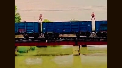 A screen grab of the video of two men on a moving train, which went viral on Thursday. A screen grab of the video of two men on a moving train, which went viral on Thursday.